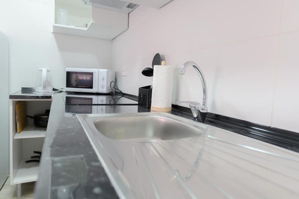 Kitchen or kitchenette, microwave, stove, kitchen
