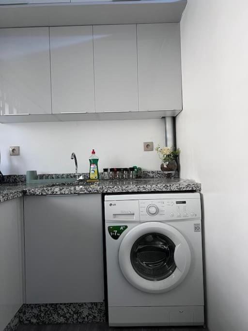 Kitchen or kitchenette, washing machine