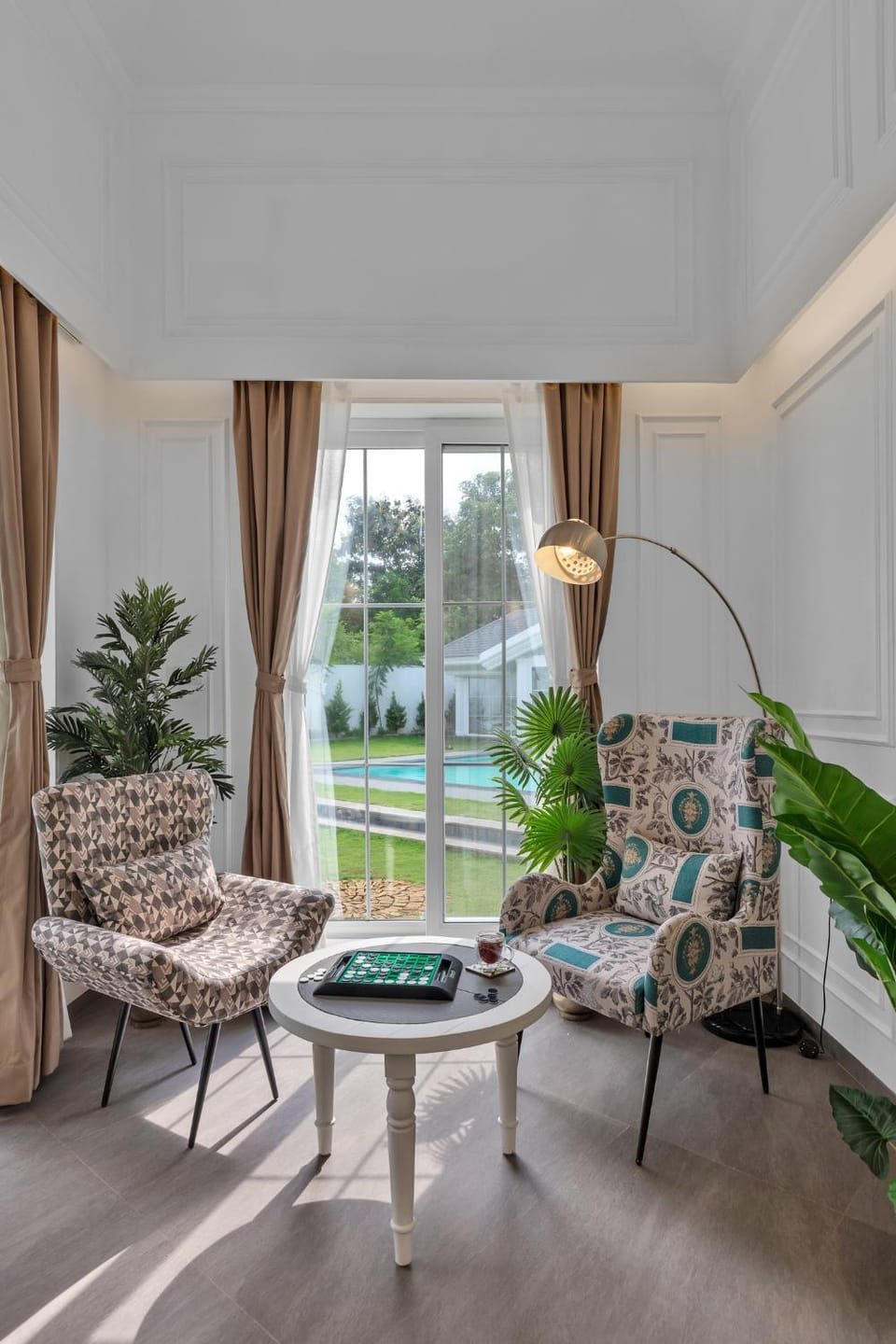 Living room, Seating area, Garden view, Pool view