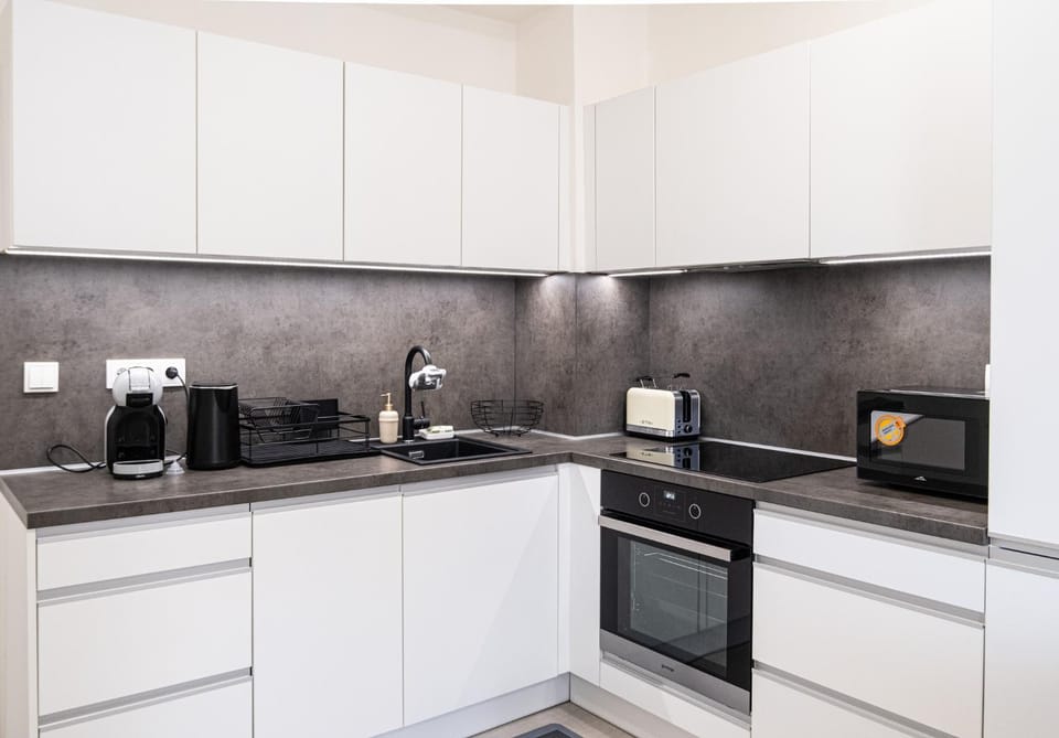 Kitchen or kitchenette, dishwasher, oven, stove, toaster