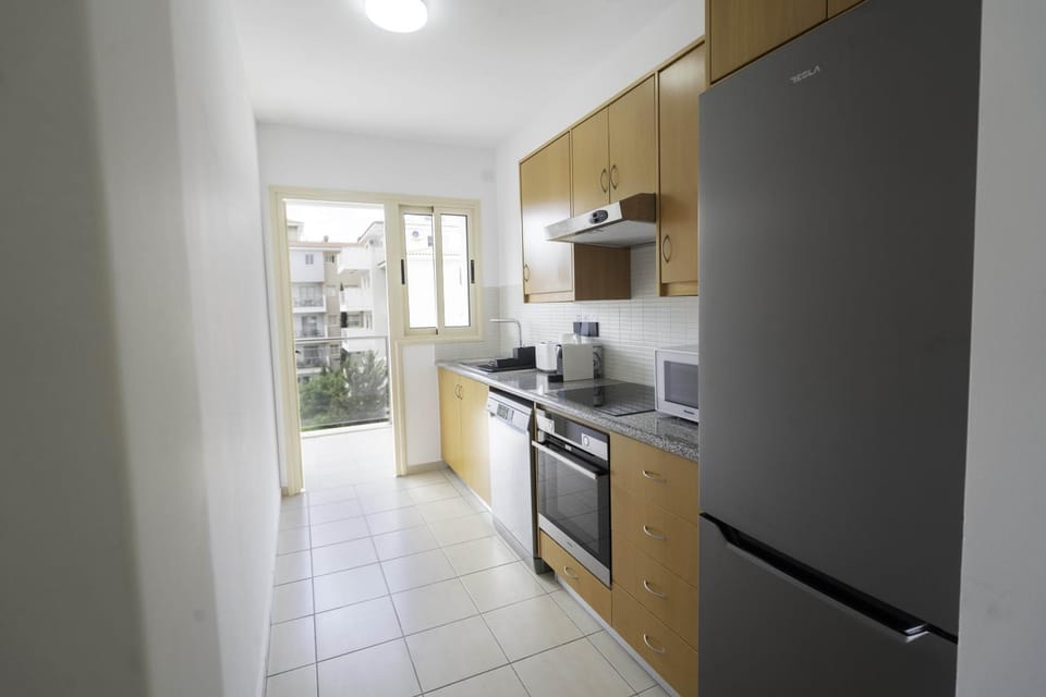 Kitchen or kitchenette, dishwasher, oven, stove