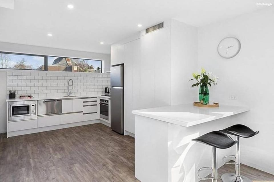 Kitchen or kitchenette, dishwasher, oven, stove, toaster