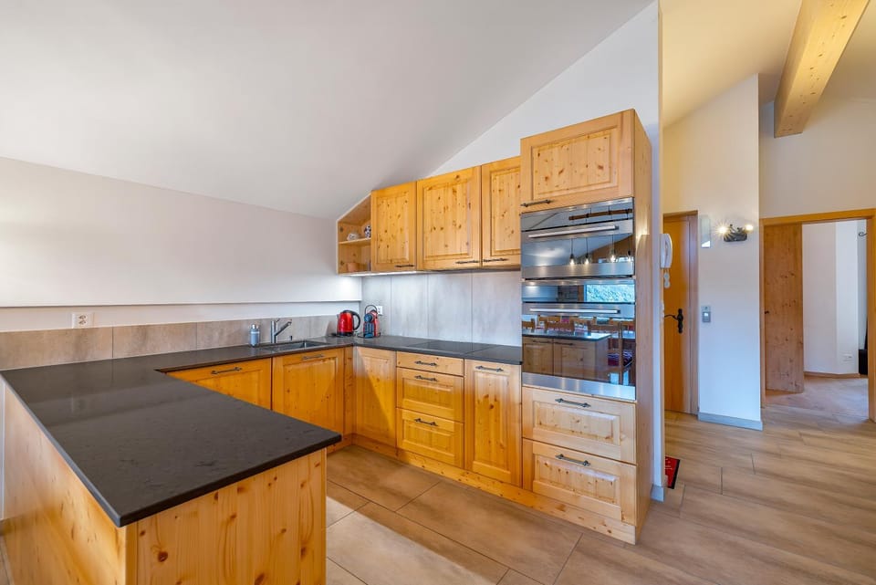 Kitchen or kitchenette, dishwasher, oven, stove