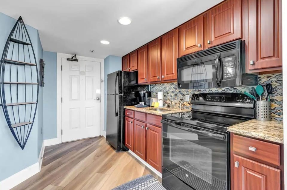 Kitchen or kitchenette, dishwasher, oven, stove
