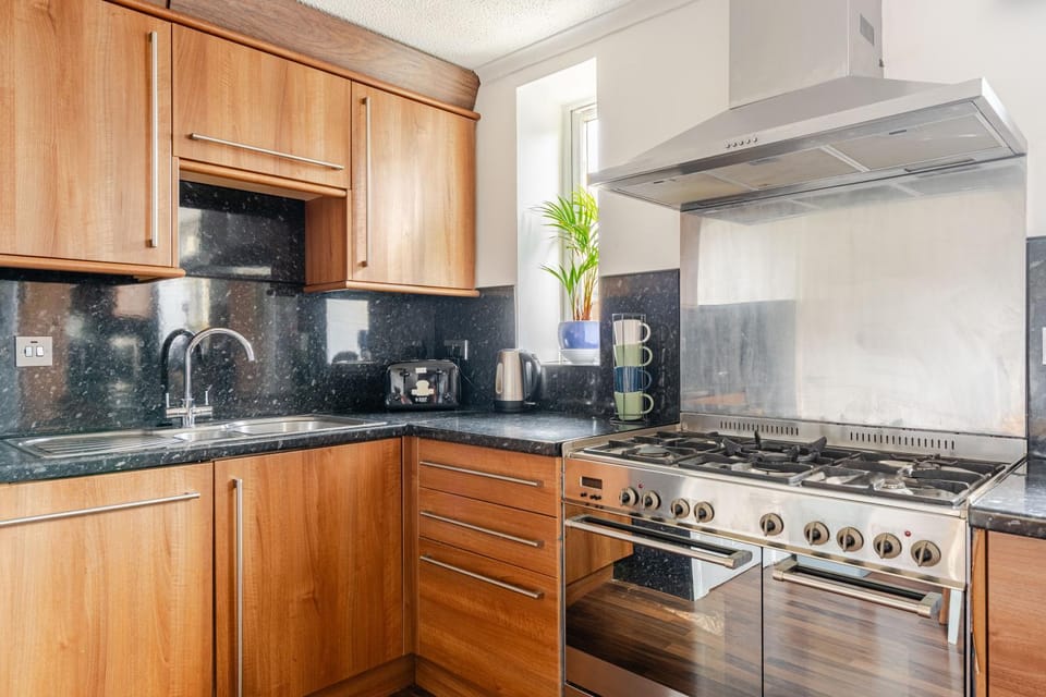 Kitchen or kitchenette, stove, toaster