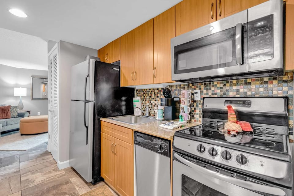 Kitchen or kitchenette, dishwasher, stove, toaster