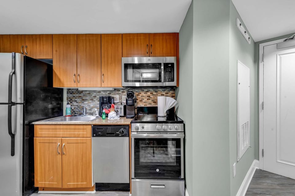 Kitchen or kitchenette, dishwasher, oven, stove, toaster