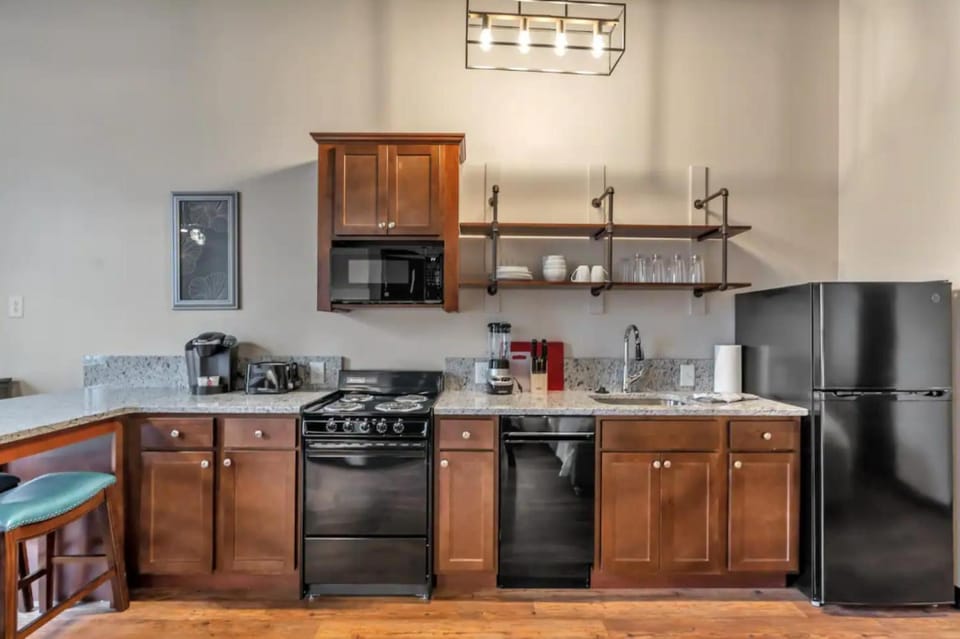 Kitchen or kitchenette, dishwasher, oven, stove, toaster