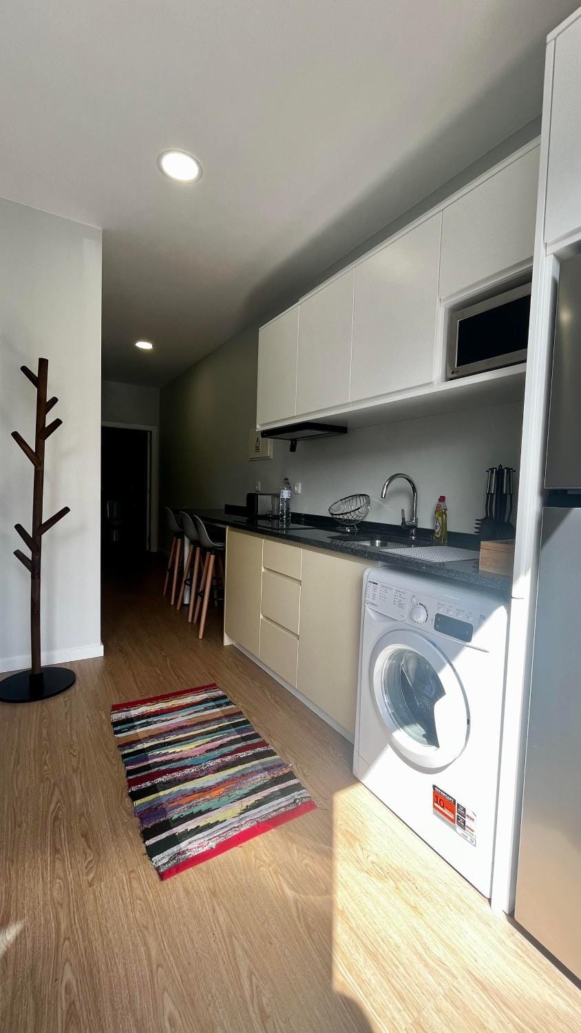 Kitchen or kitchenette, stove, washing machine