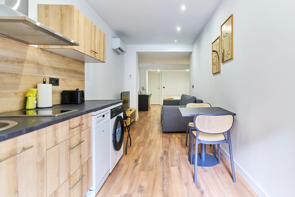 Kitchen or kitchenette, dishwasher, stove, toaster