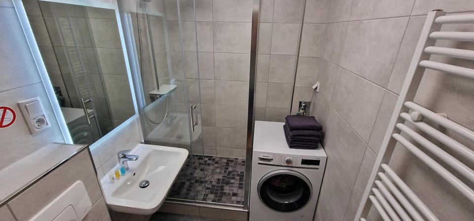 Shower, Toilet, Bathroom, towels, washing machine, dryer