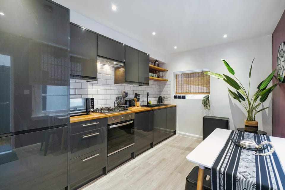 Kitchen or kitchenette, dishwasher, oven, stove, toaster