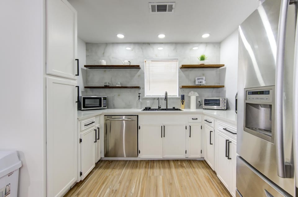 Kitchen or kitchenette, dishwasher, oven, stove