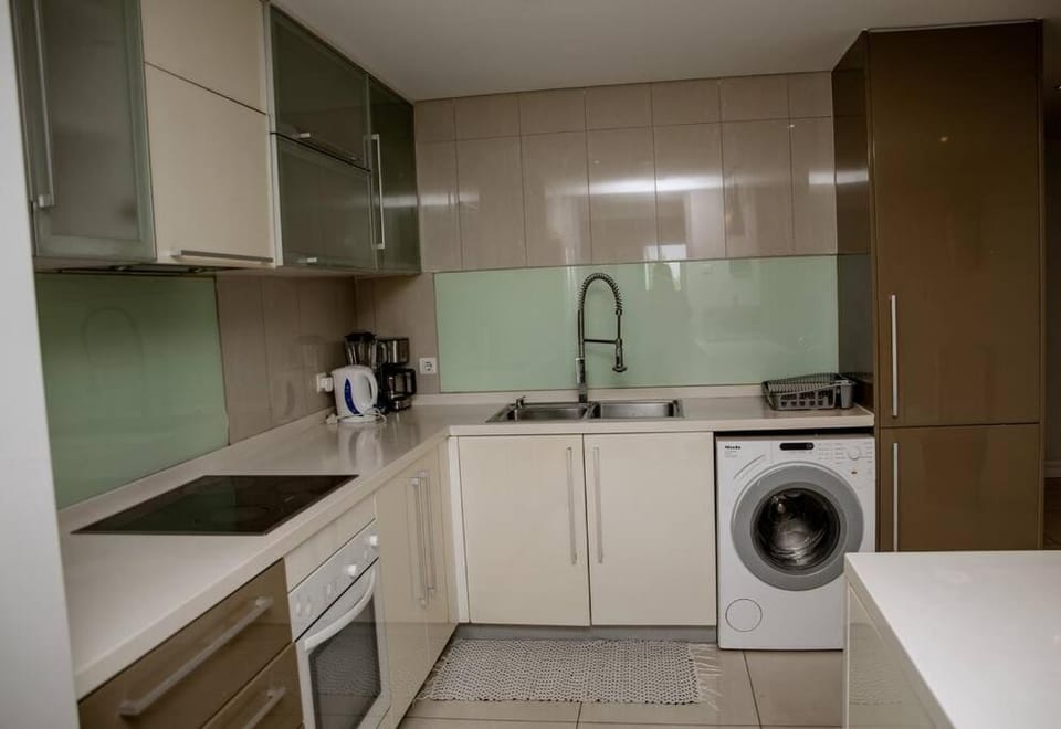 Kitchen or kitchenette, washing machine