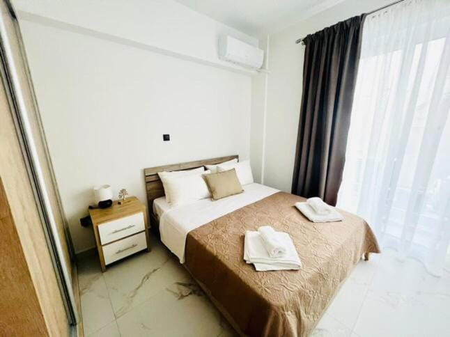 Photo of the whole room, Bedroom, towels, air conditioner