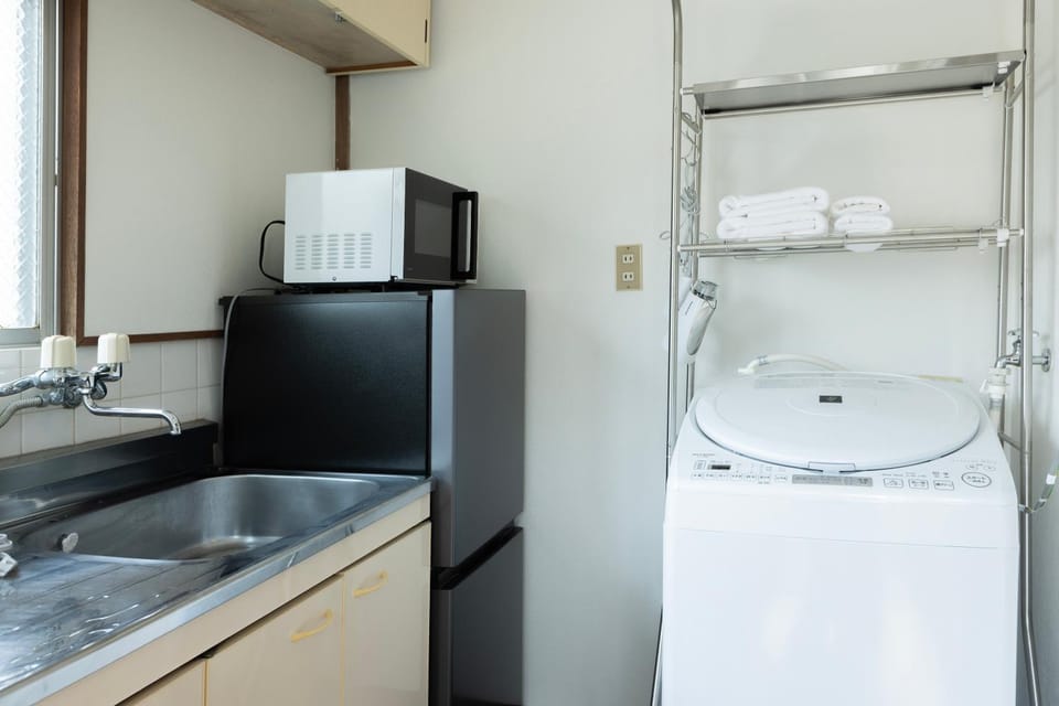 Kitchen or kitchenette, washing machine