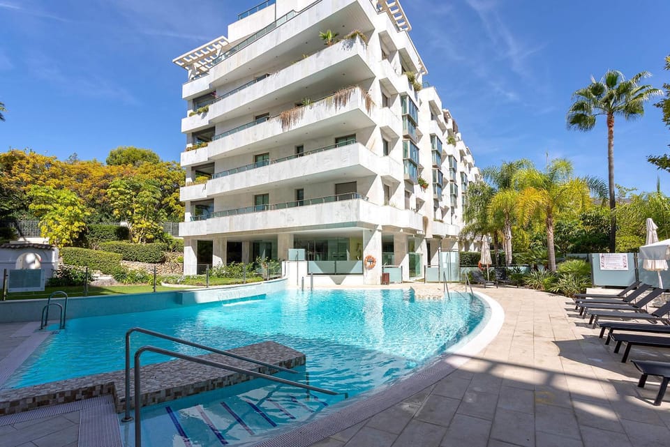 Property building, Patio, Spring, Day, Pool view, Swimming pool, Parking, sunbed