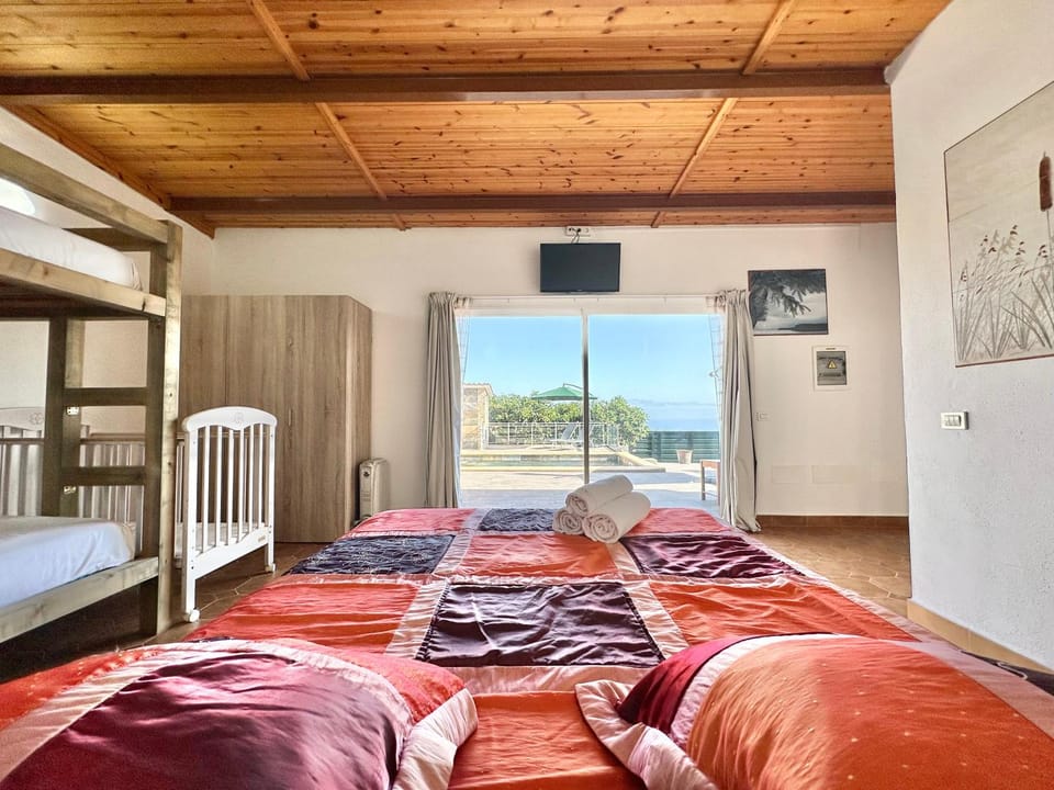 Bed, TV and multimedia, View (from property/room), Bedroom, cot, bunk bed