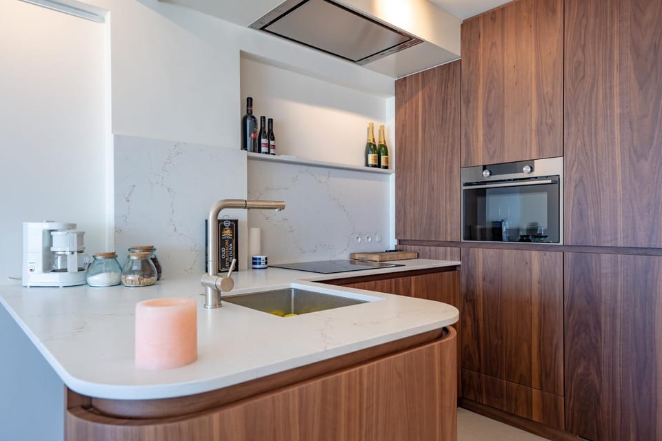 Kitchen or kitchenette, dishwasher, oven, stove