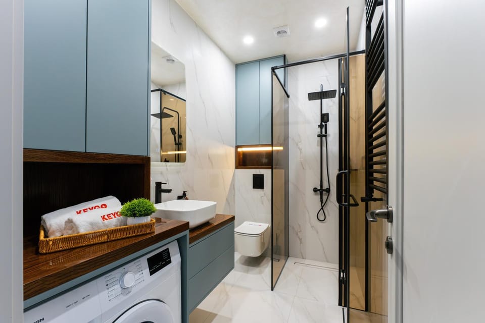 Shower, Toilet, Bathroom, towels, washing machine, dryer