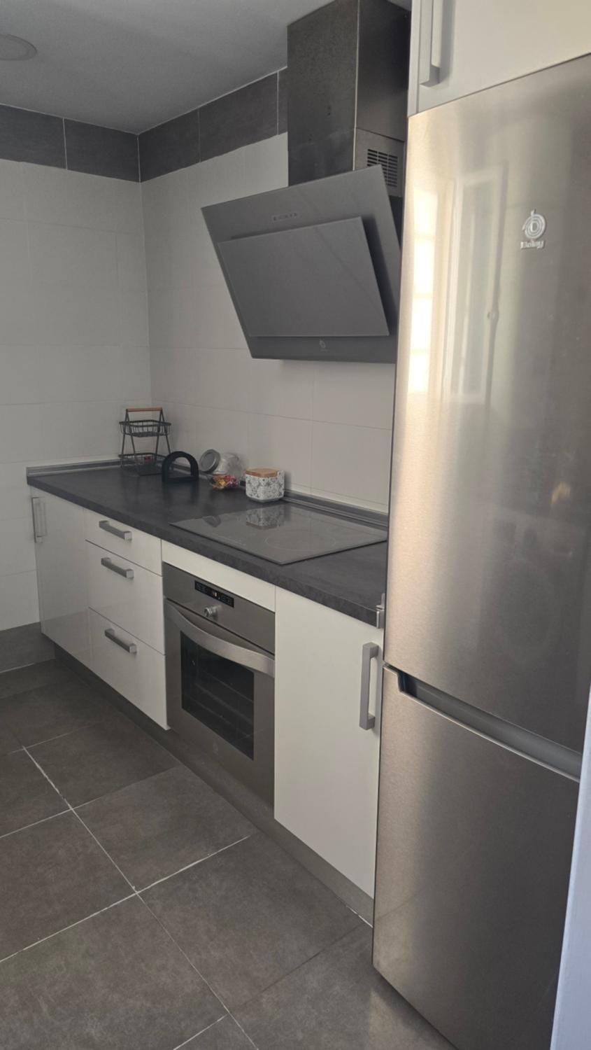Kitchen or kitchenette, dishwasher, oven, stove