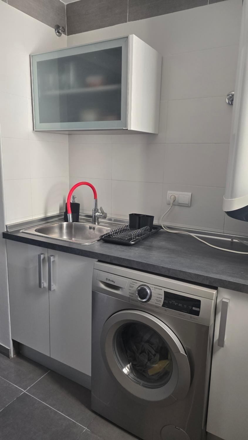 Kitchen or kitchenette, washing machine
