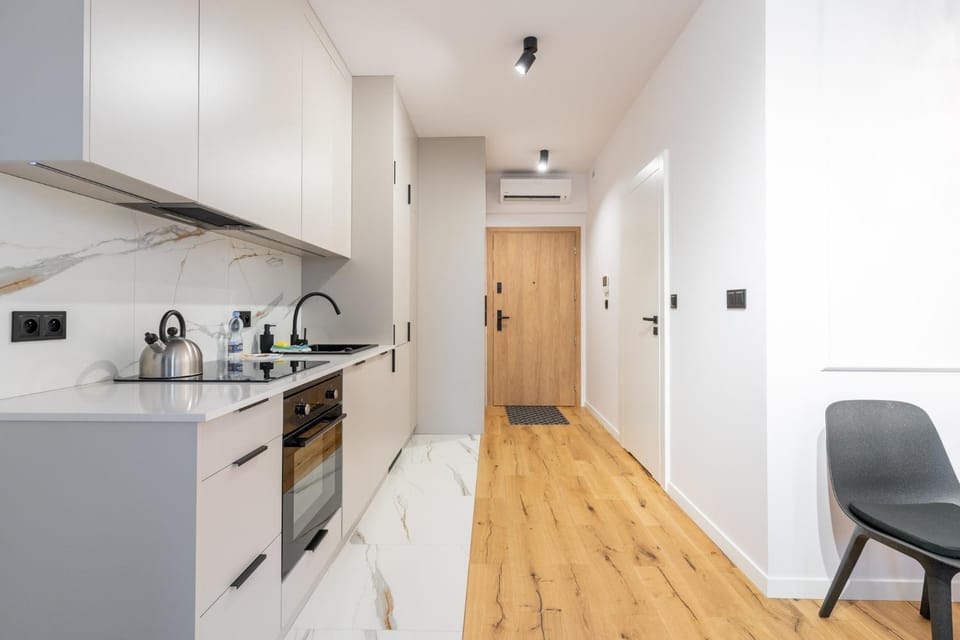 Kitchen or kitchenette, dishwasher, oven, stove