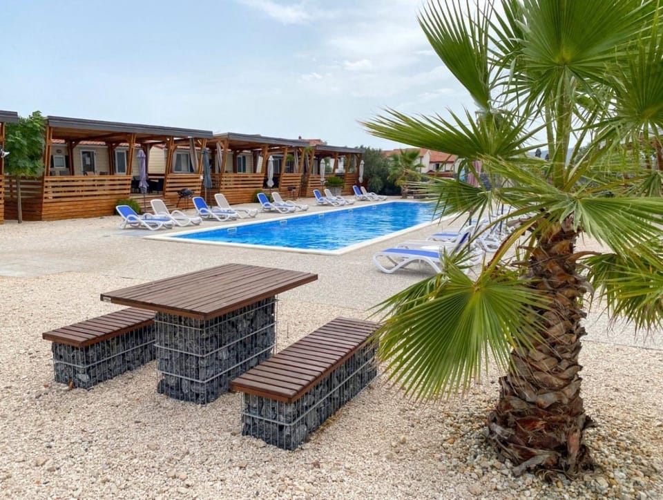 Property building, Patio, Pool view, Swimming pool, sunbed
