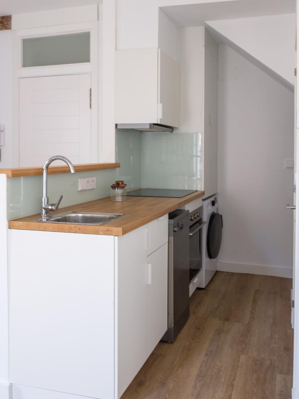 Kitchen or kitchenette, dishwasher, oven, stove, washing machine, dryer