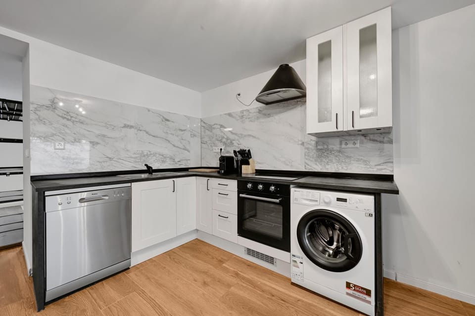 Kitchen or kitchenette, dishwasher, oven, stove, washing machine