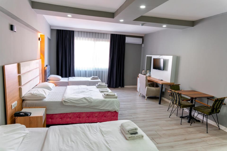 Bed, TV and multimedia, Living room, Photo of the whole room, Seating area, Bedroom, hair dresser, towels, air conditioner