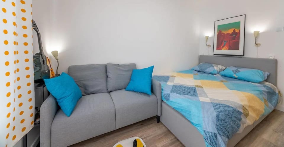 Bed, Living room, Seating area, Bedroom