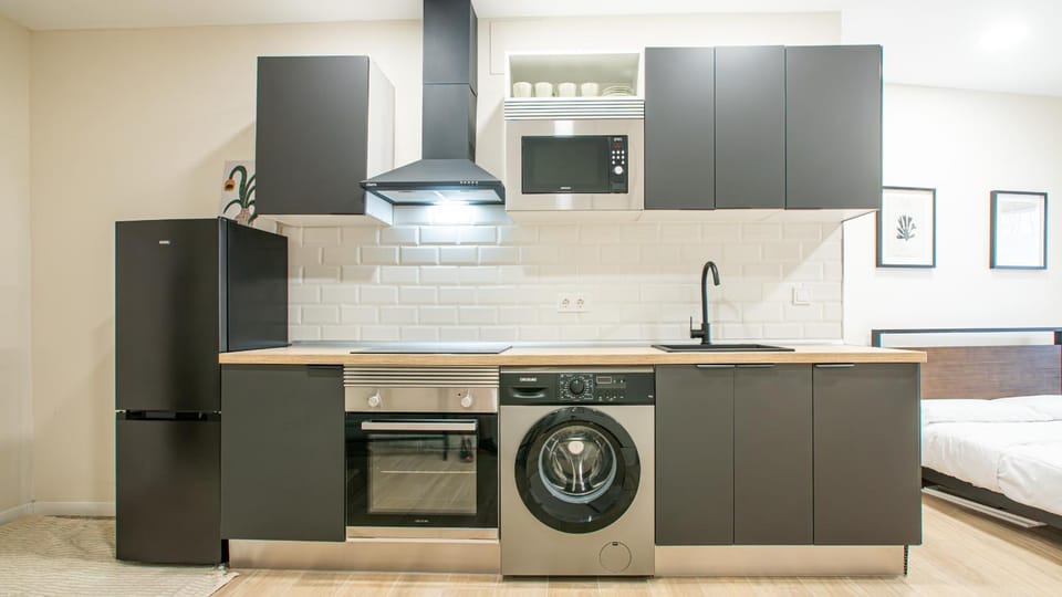 Kitchen or kitchenette, stove, washing machine