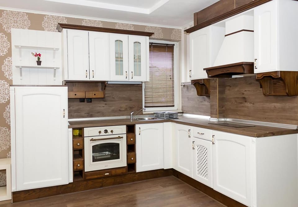 Kitchen or kitchenette, dishwasher, microwave, oven, stove