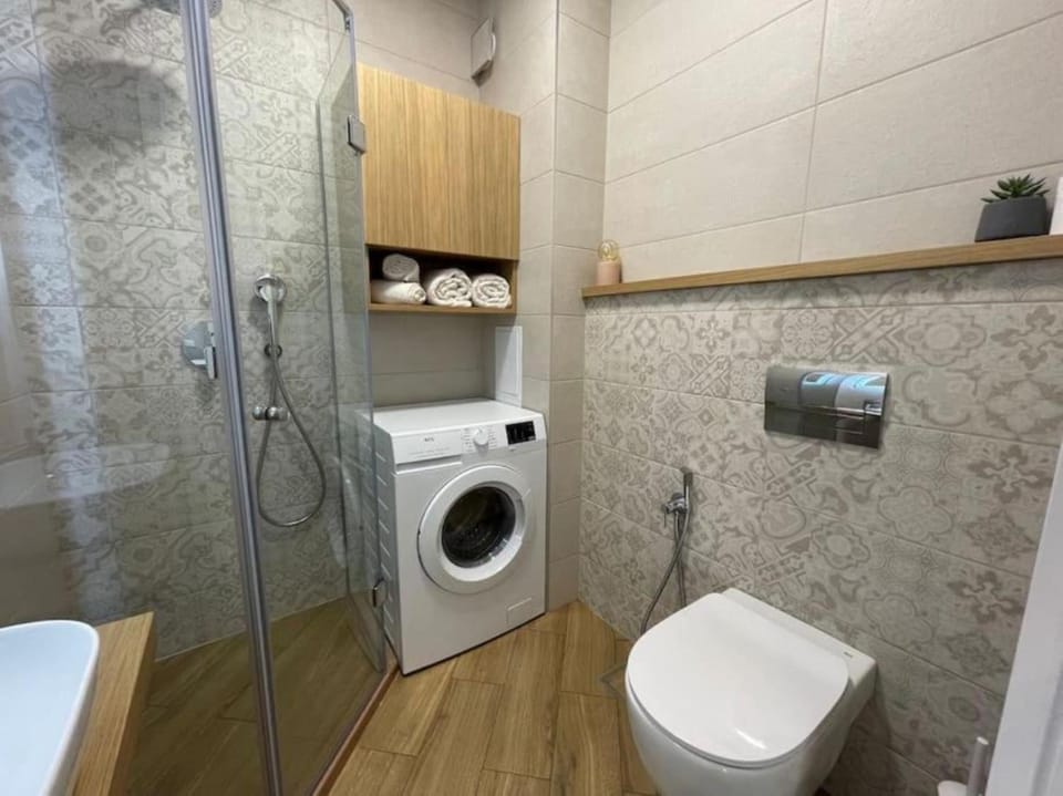 Shower, Toilet, Bathroom, towels, washing machine, dryer