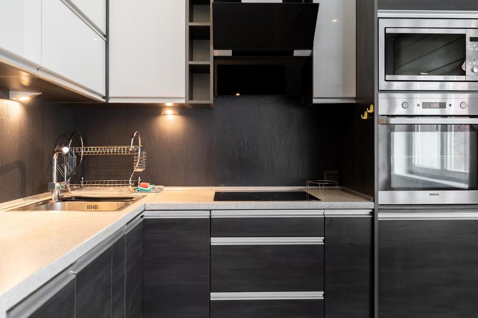 Kitchen or kitchenette, dishwasher, oven, stove