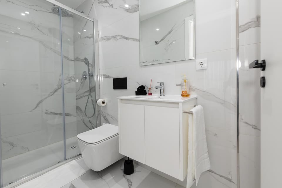 Shower, Toilet, Bathroom, hair dryier, towels