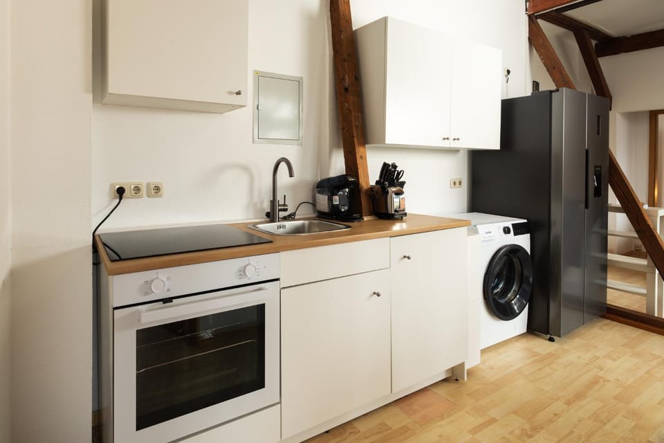 Kitchen or kitchenette, stove, toaster, washing machine