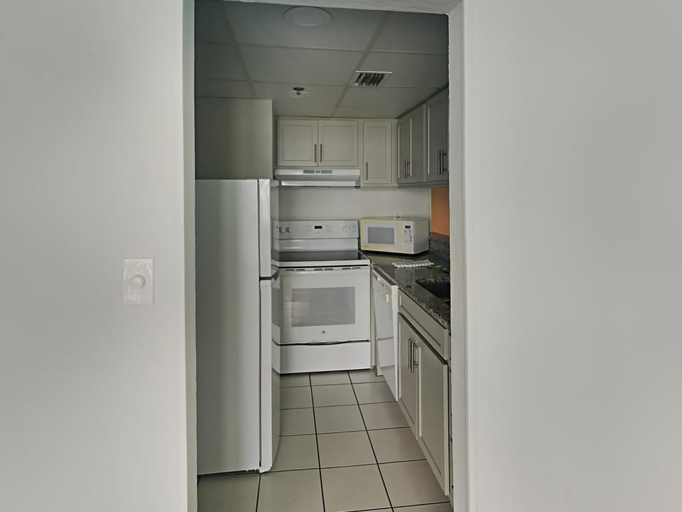 Kitchen or kitchenette, dishwasher, microwave, oven, stove, kitchen