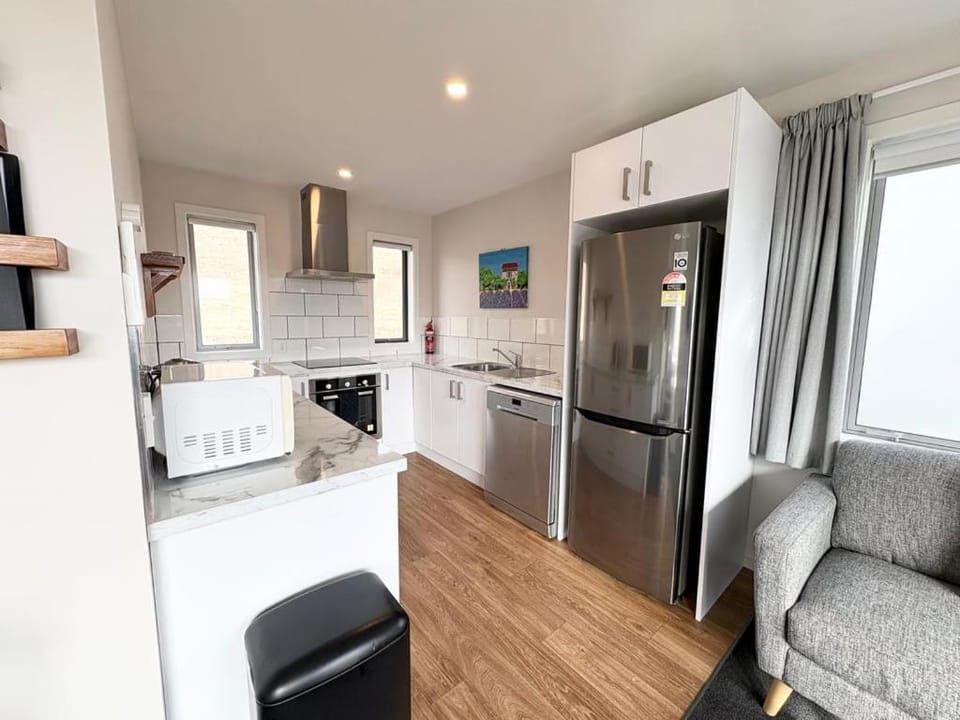 Kitchen or kitchenette, dishwasher, oven, stove, toaster