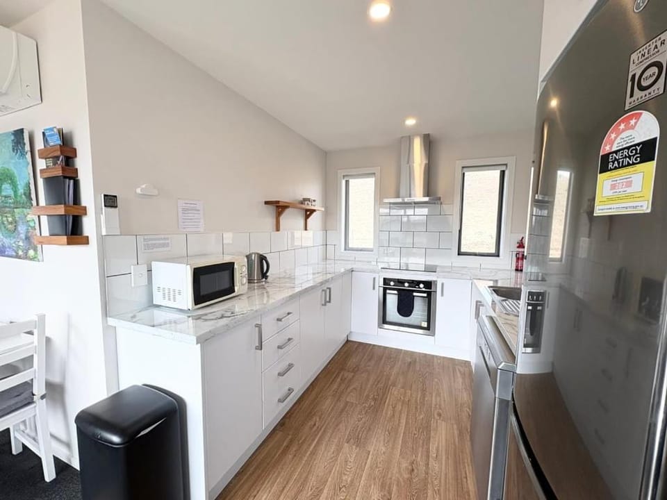 Kitchen or kitchenette, dishwasher, oven, stove, toaster