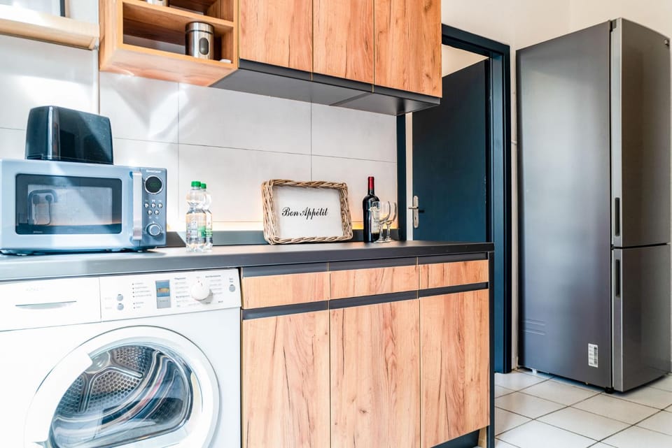 Kitchen or kitchenette, dishwasher, oven, stove, washing machine, dryer