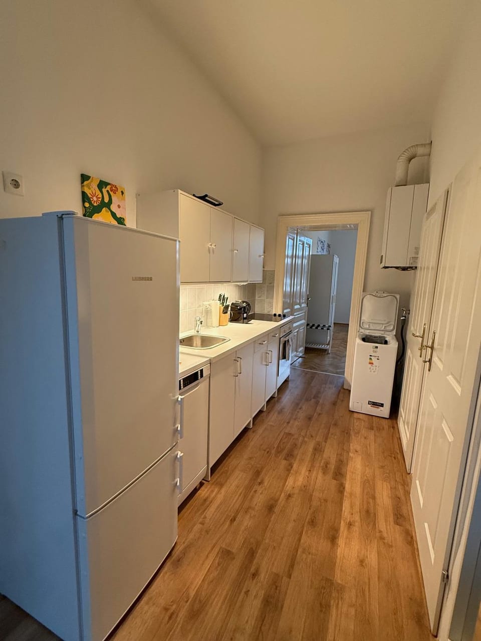 Kitchen or kitchenette, dishwasher, stove, washing machine