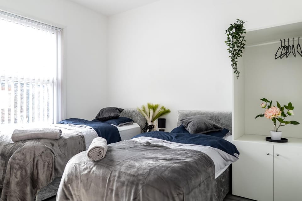 Photo of the whole room, Bedroom, flat iron, hair dryier, towels, wardrobe