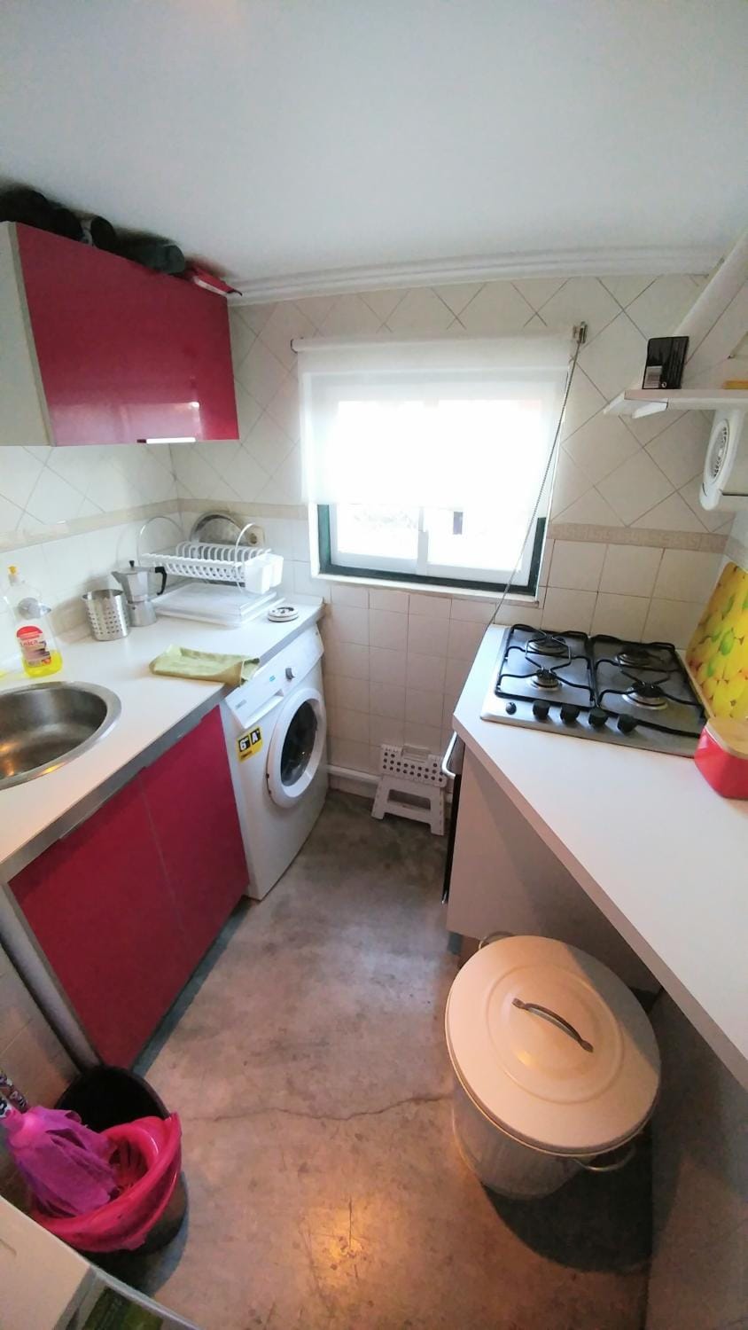 Kitchen or kitchenette, stove, washing machine