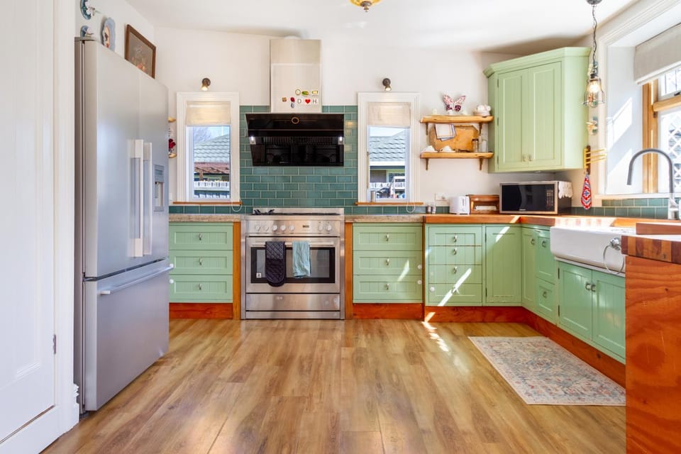 Kitchen or kitchenette, dishwasher, microwave, oven, stove, toaster