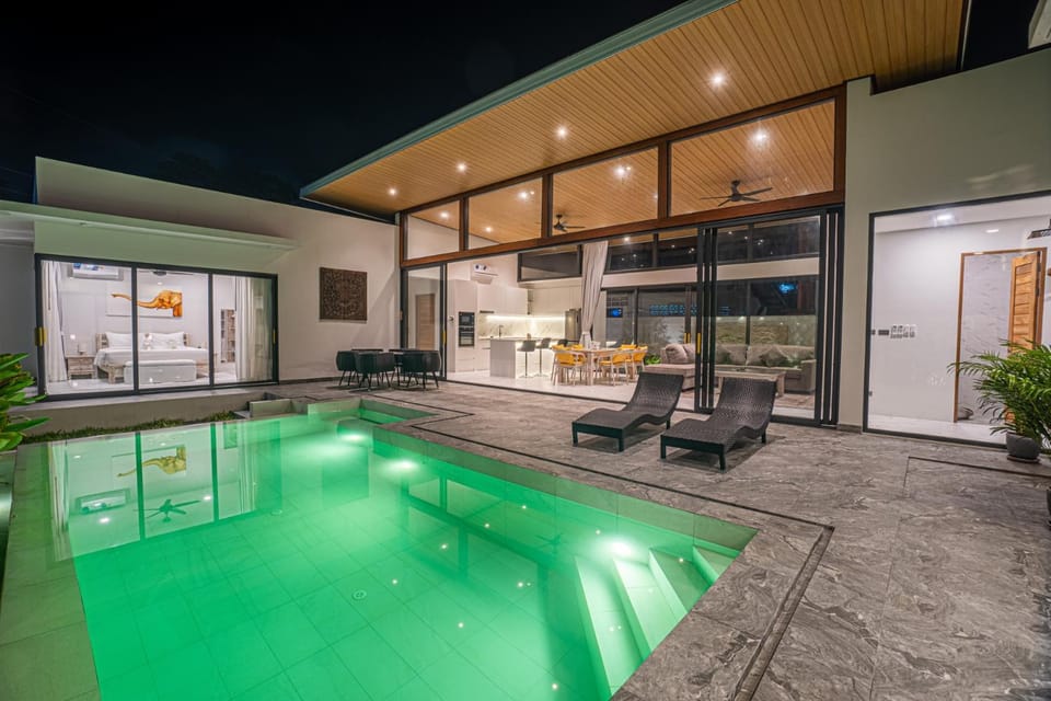 Patio, Night, Living room, Seating area, Pool view, Swimming pool, sunbed