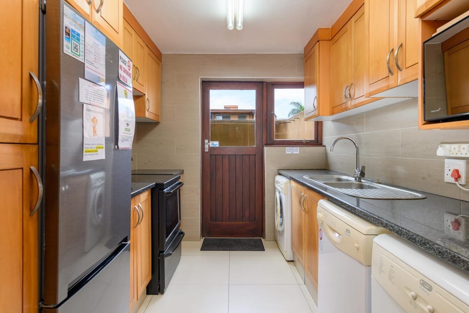 Kitchen or kitchenette, dishwasher, microwave, washing machine, dryer