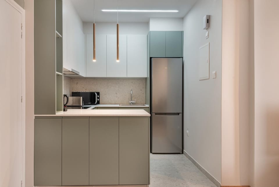 Kitchen or kitchenette, dishwasher, oven, stove