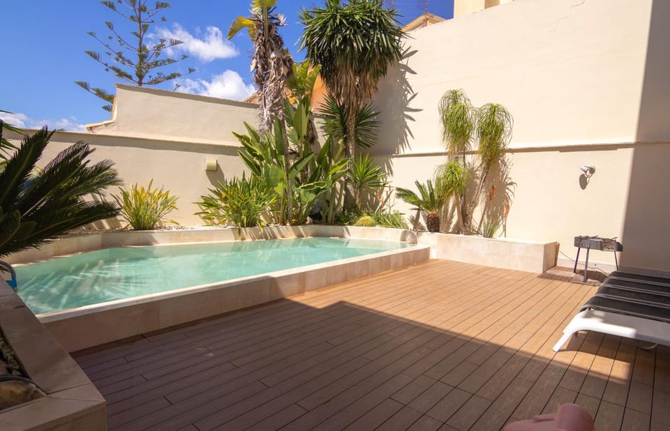 Patio, Day, Natural landscape, Pool view, Swimming pool, sunbed